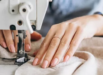 Cusătoreasă motoristă